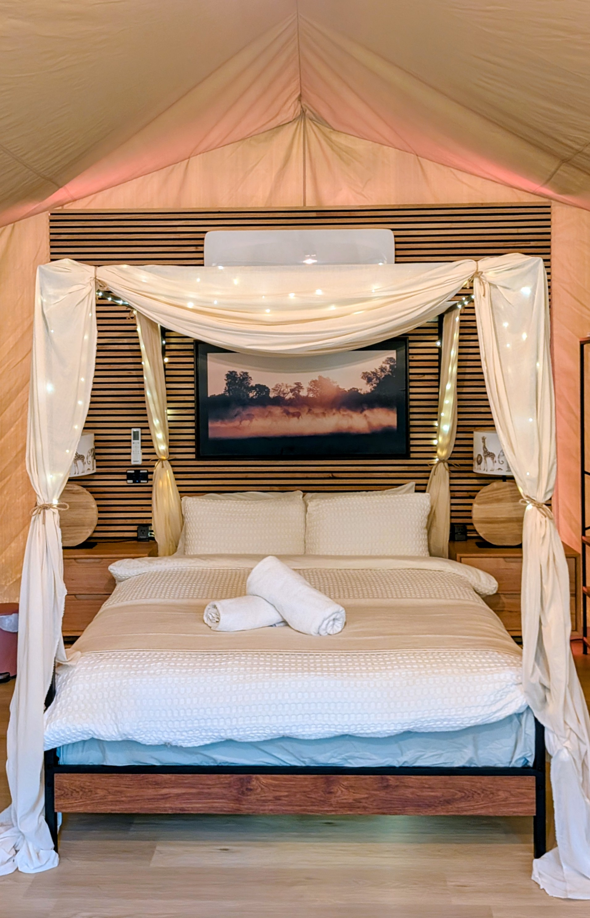 Luxury bed inside a glamping accommodation